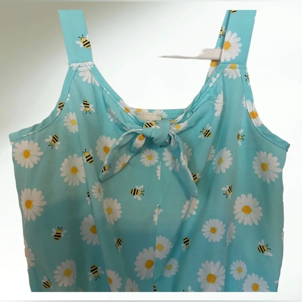 Lily Bleu Short romper in light blue aqua with white flowers and tie front.